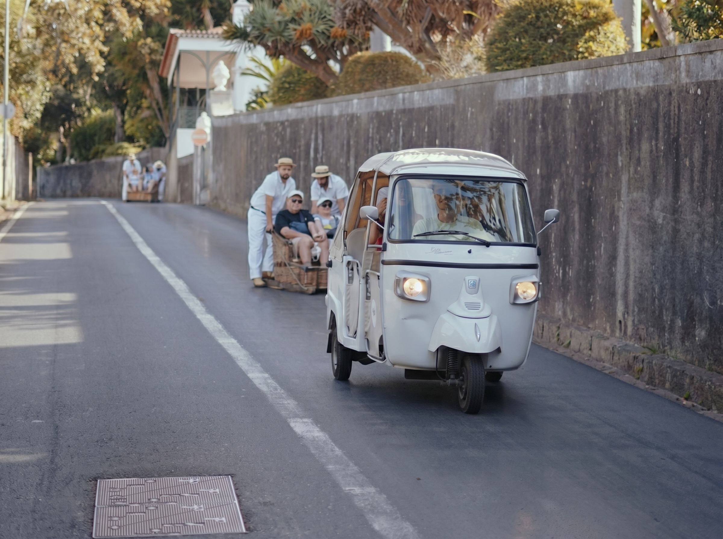 Tuk tuk driving along the dramatic Atlantic coastline of Madeira