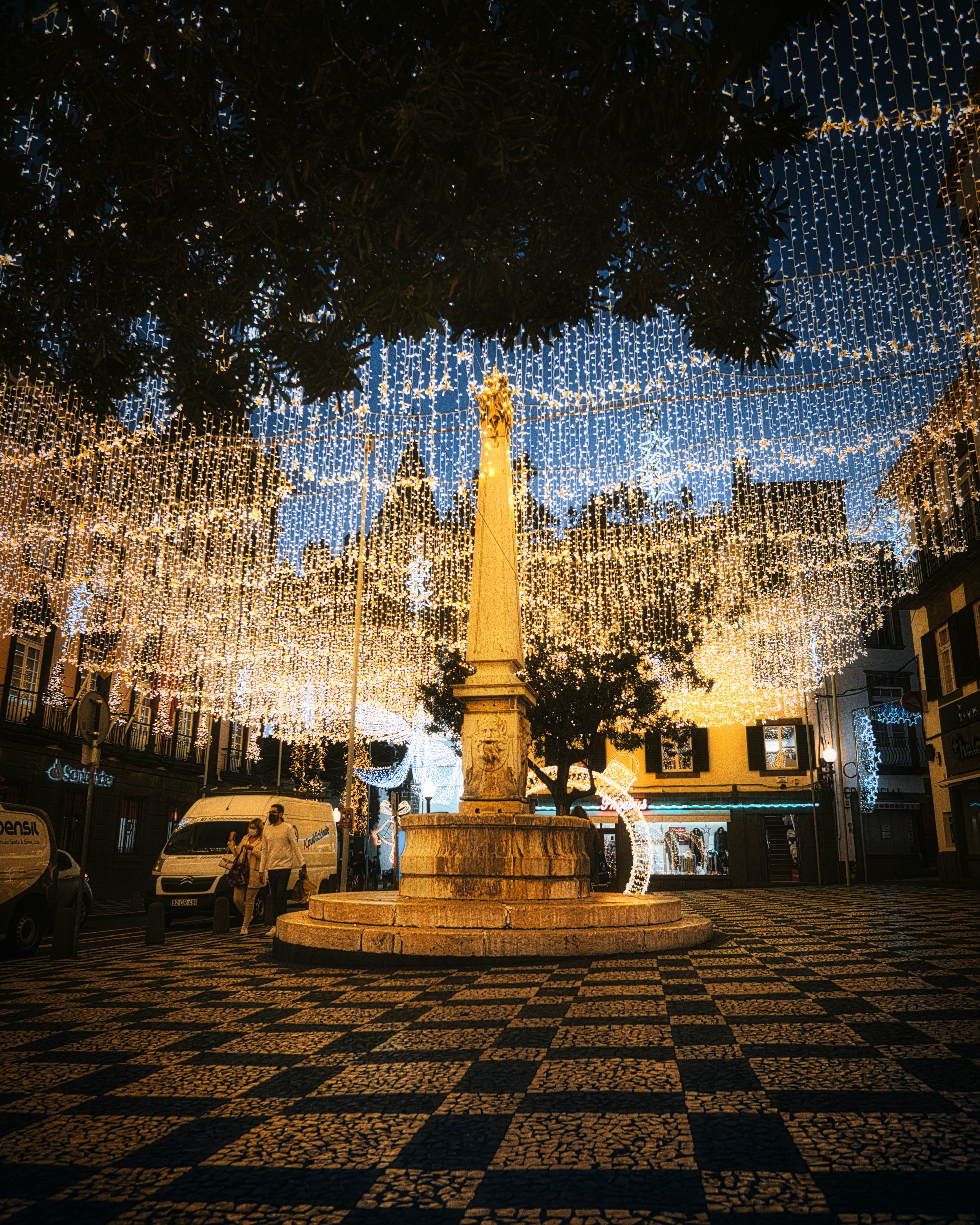 Buildings and gardens lit with Christmas decorations Funchal Madeira