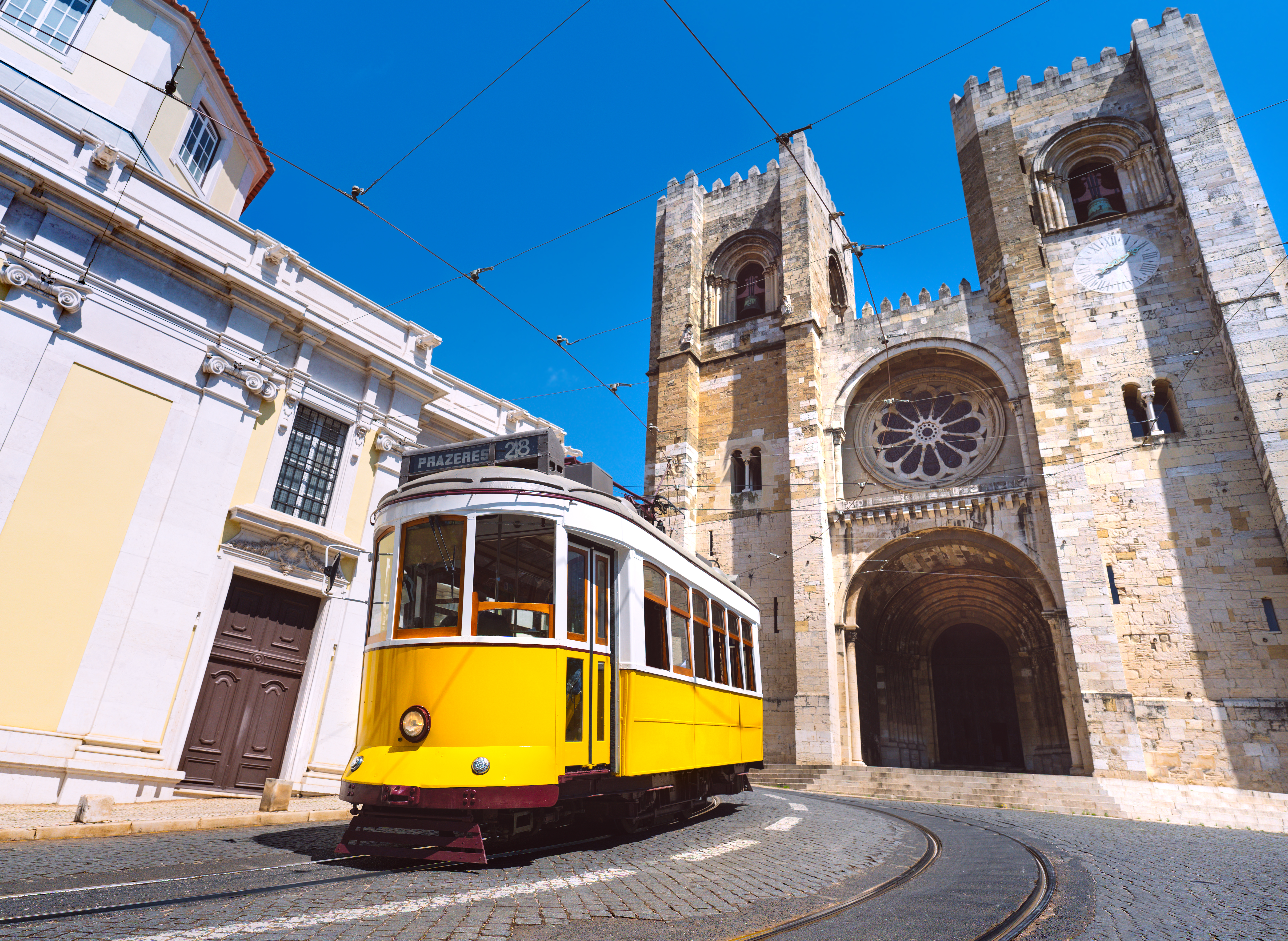 Alfama historic district Lisbon — terracotta rooftops and narrow cobblestone streets on the East to West tuk tuk tour