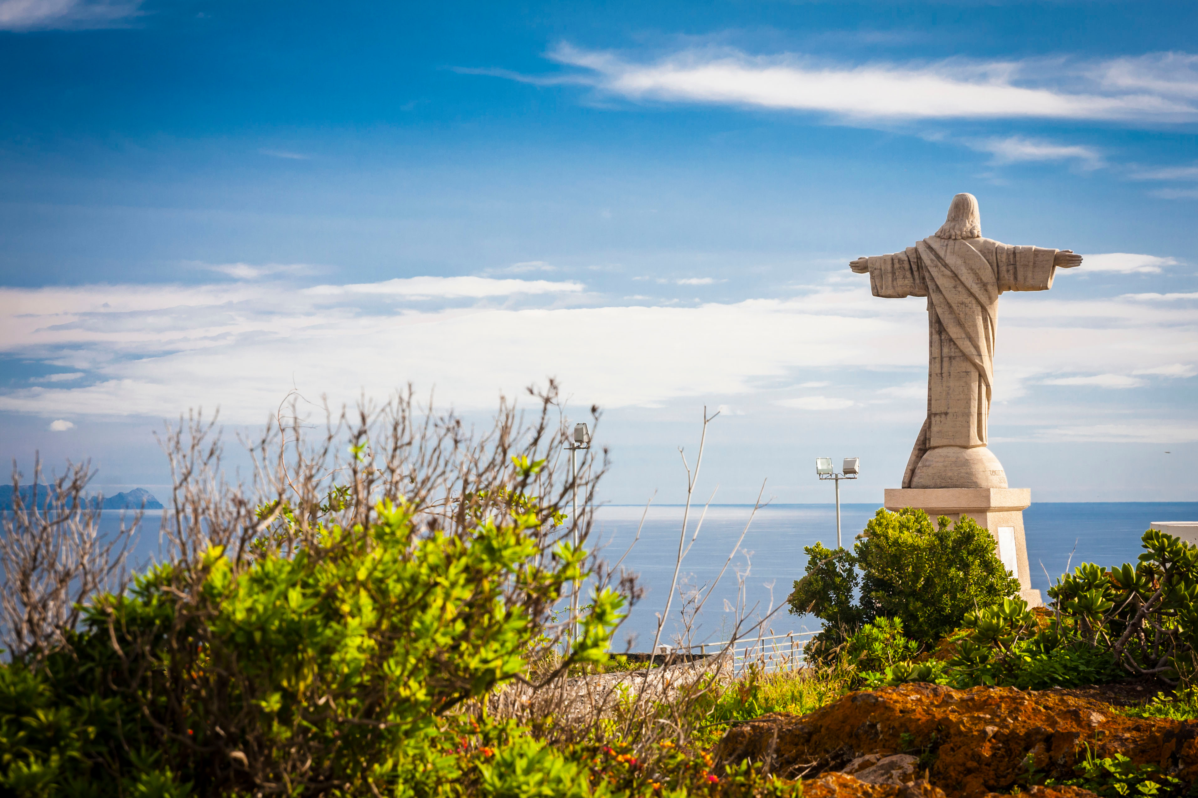 Garajau Cristo Rei statue clifftop Madeira Atlantic Ocean marine reserve — hidden gem tuk tuk tour
